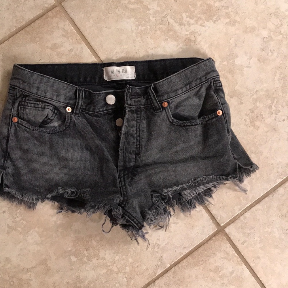 Free people black distressed cutoffs